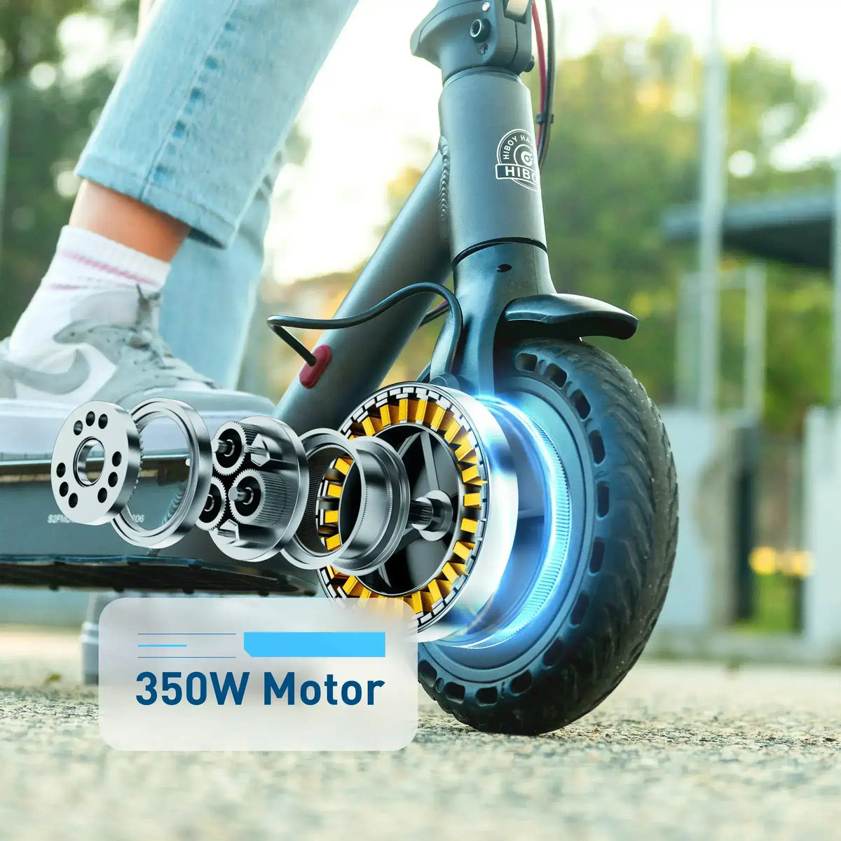 Electric scooter front wheel with 350W motor, close-up showing motor components and rider's foot