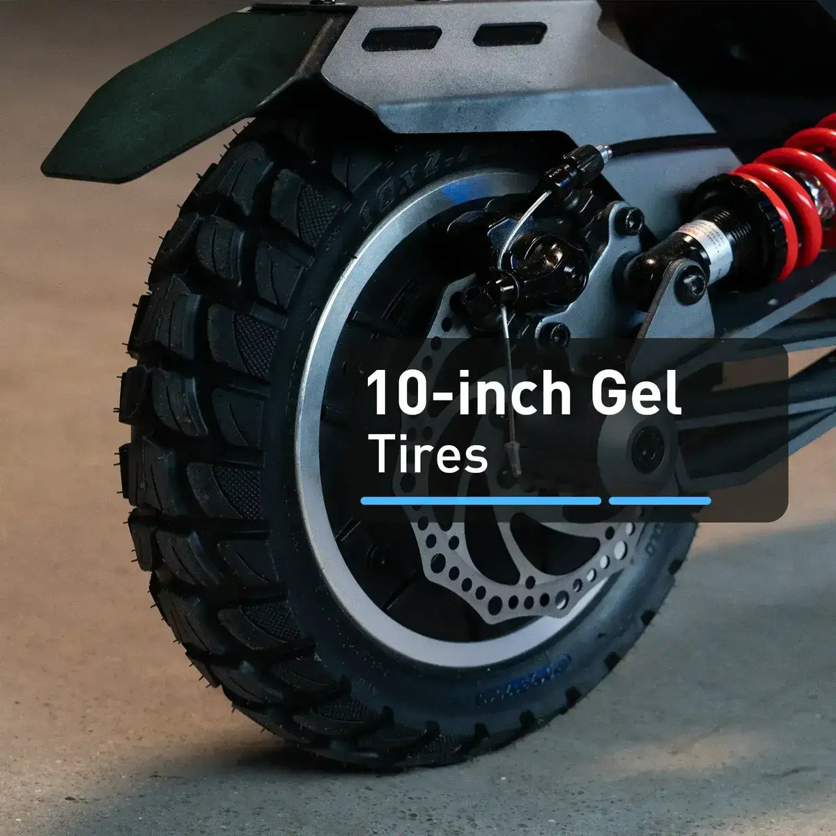Close-up of 10-inch gel tire with disc brake and red suspension on electric scooter