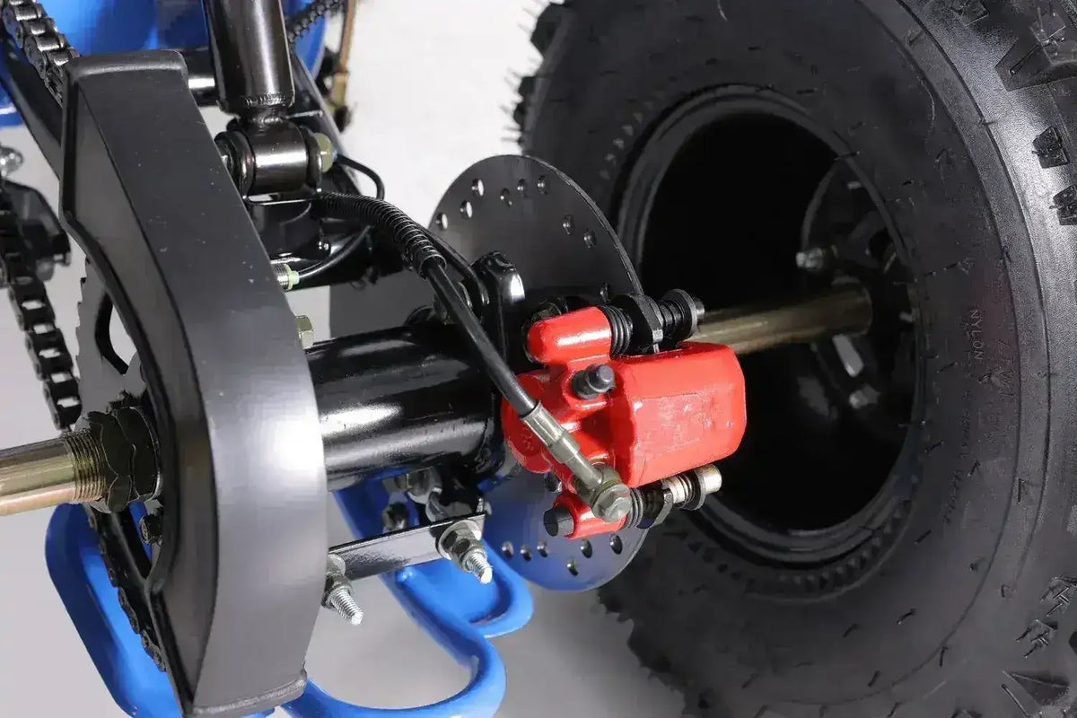 Closeup of rear ATV wheel, disc brake, and chain at Q9 PowerSports USA