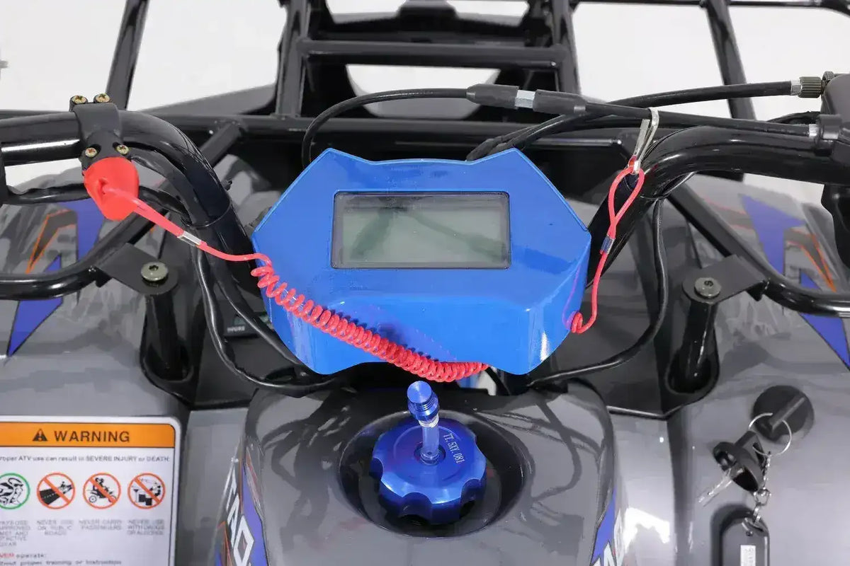 Closeup of kids' ATV dashboard with digital display, ignition keys, and safety features at Q9 PowerSports USA.
