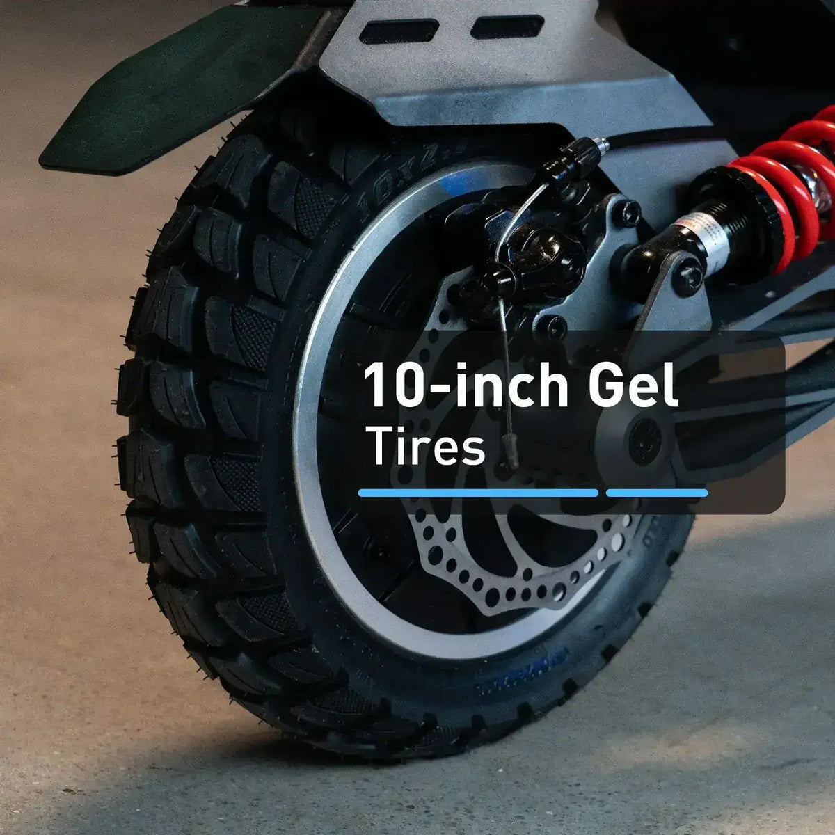 Close-up of 10-inch gel scooter tire with disc brake and red shock absorber