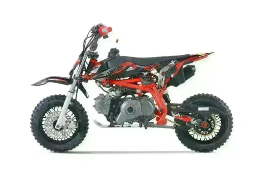 Red and black dirt bike with knobby tires, side view, off-road motorcycle for beginners