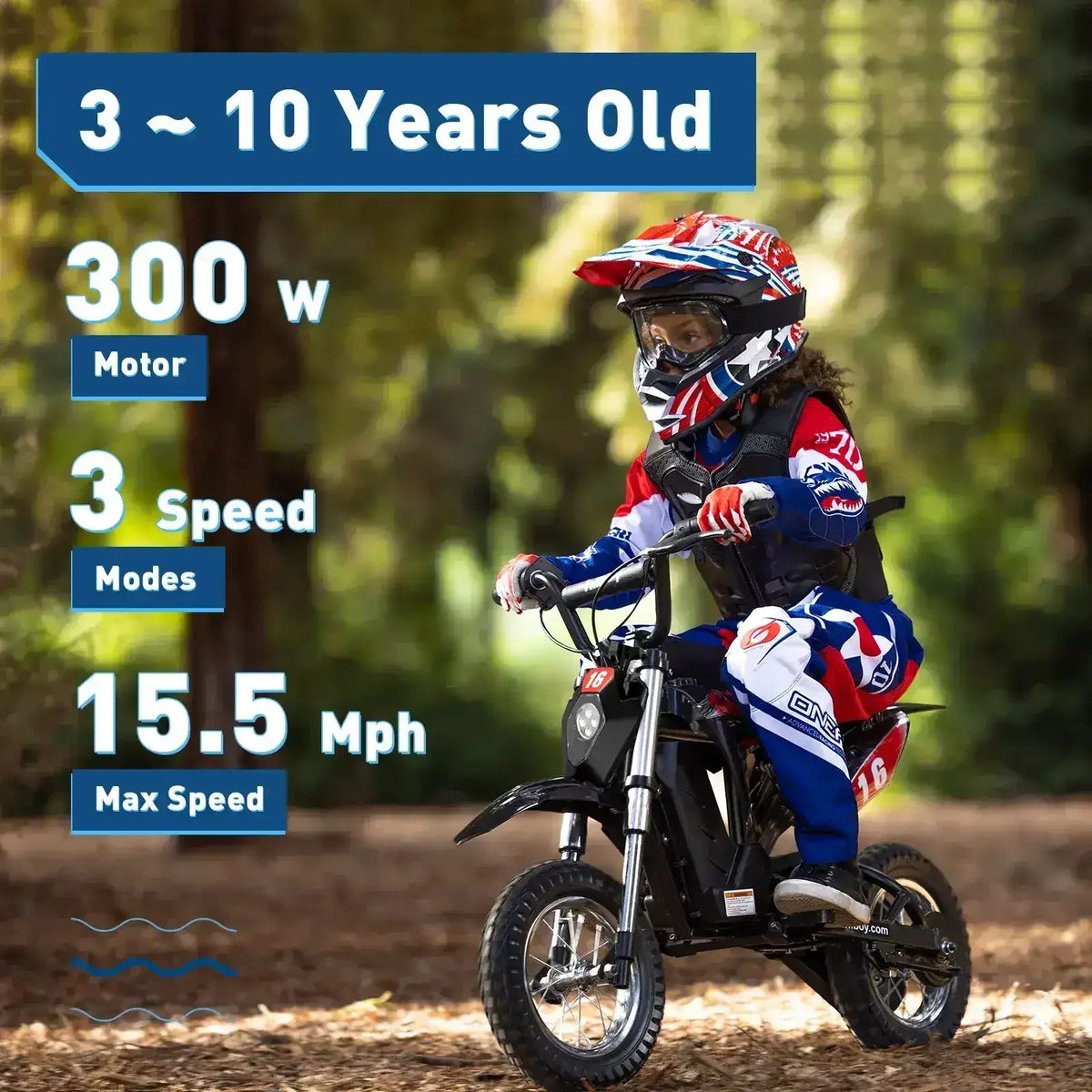 Young child in motocross gear riding a black electric dirt bike in a wooded outdoor area.