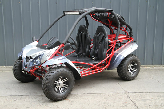 Two-seat off-road go-kart with red frame, rugged tires, and Cobra 200 decal
