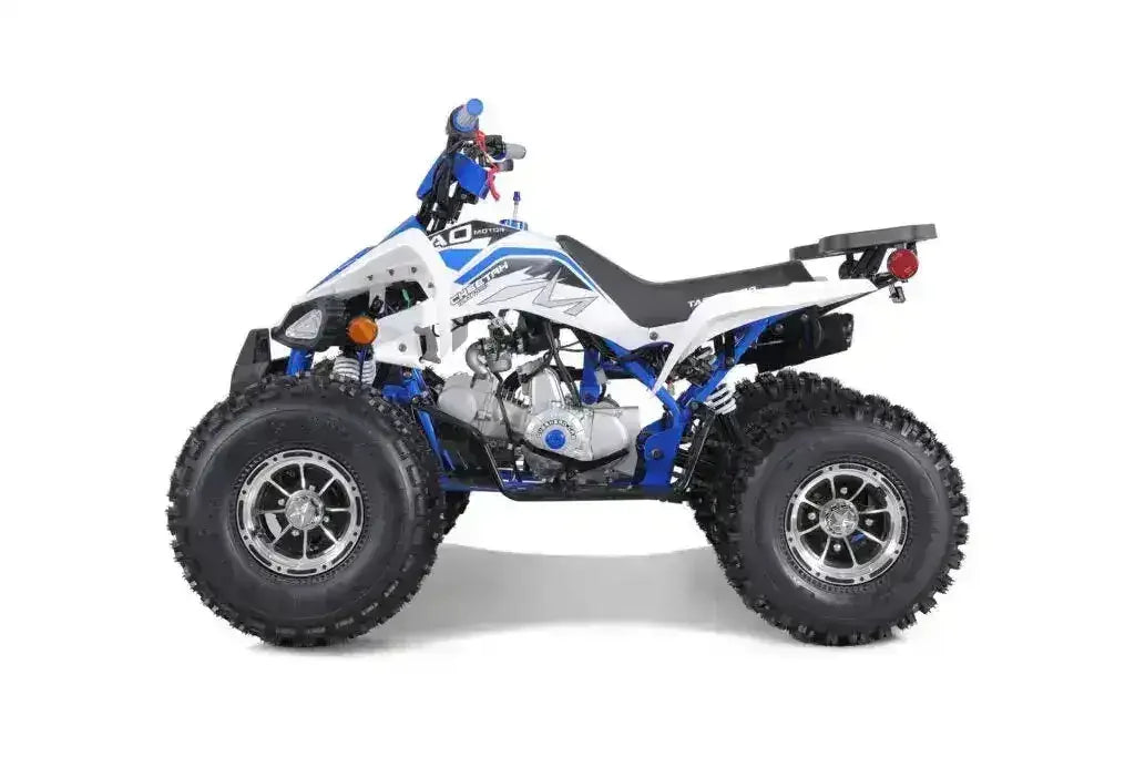 White and blue youth ATV with knobby tires, shown on a plain white background.
