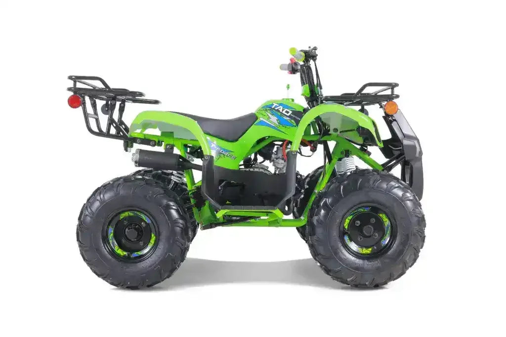 Green four-wheeler ATV with large all-terrain tires and rear cargo racks, side view