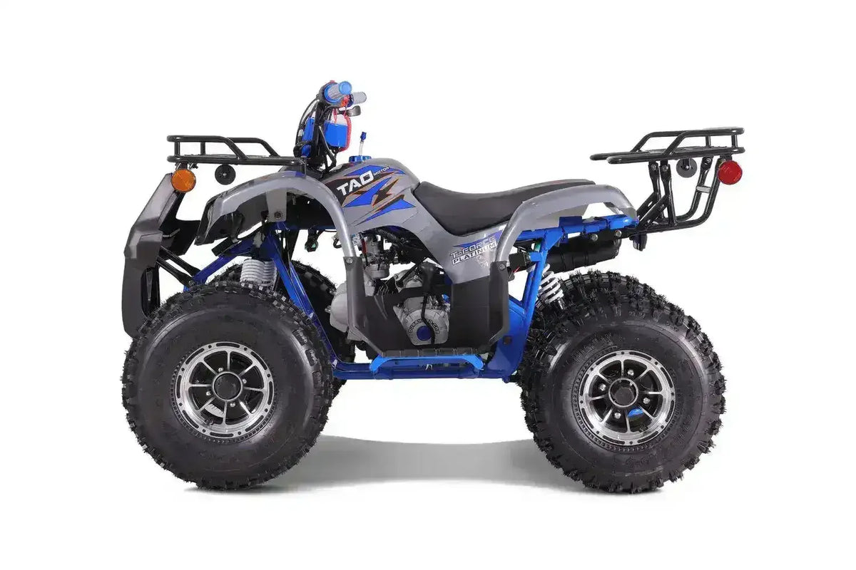 Gray and blue youth ATV with rugged tires, side profile, at Q9 PowerSports USA