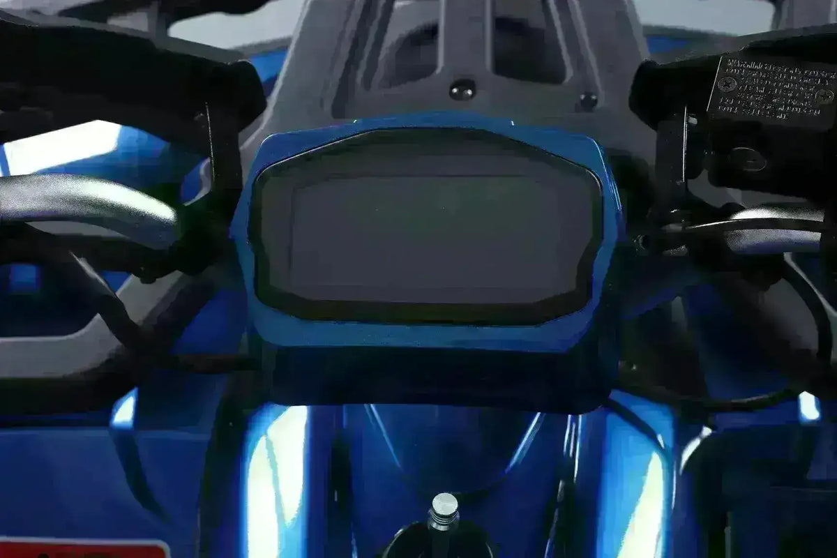 Digital speedometer and handlebars of a blue utility ATV four-wheeler