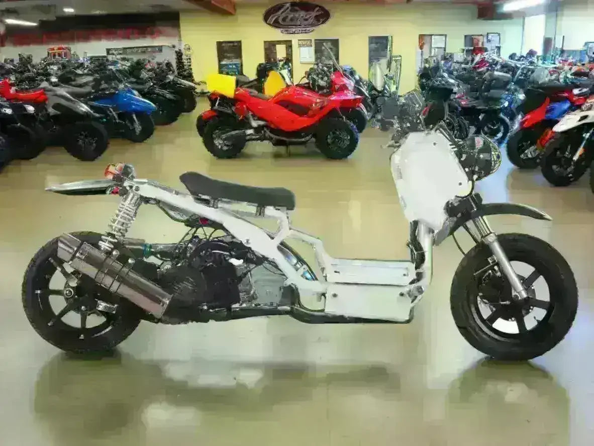 Icebear Maddog 150cc scooter frame in a showroom with ATVs and scooters in the background