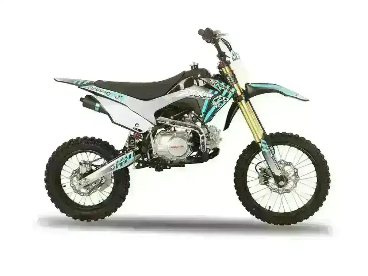 Side view of a 125cc youth dirt bike with knobby tires and sporty graphics on a white background.