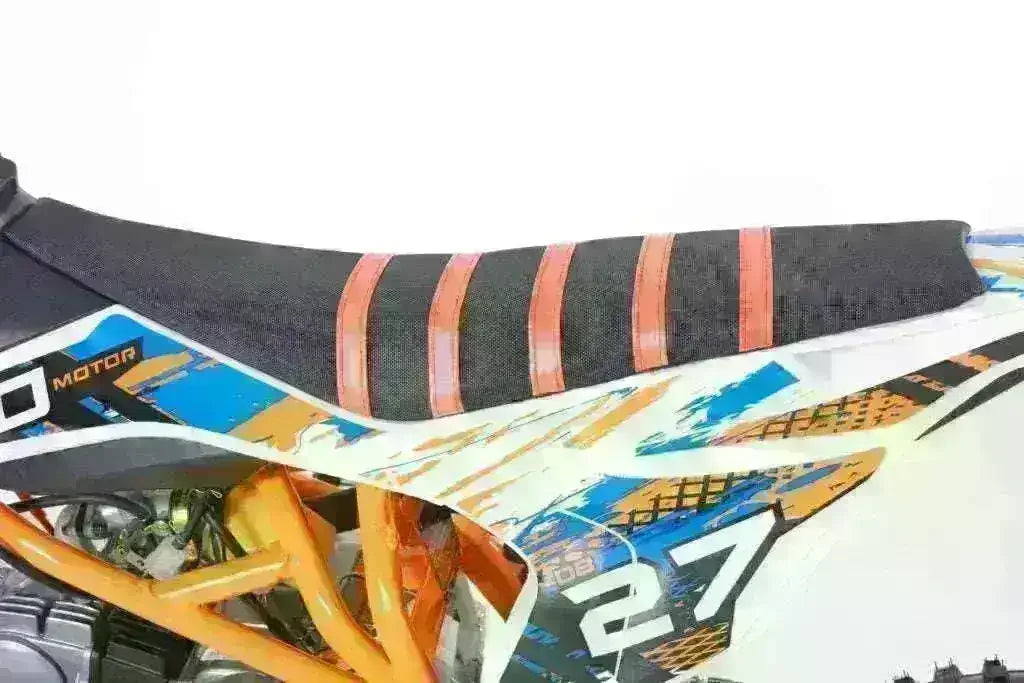 Close-up of DB27 125cc dirt bike seat with orange and black graphics and number 27.