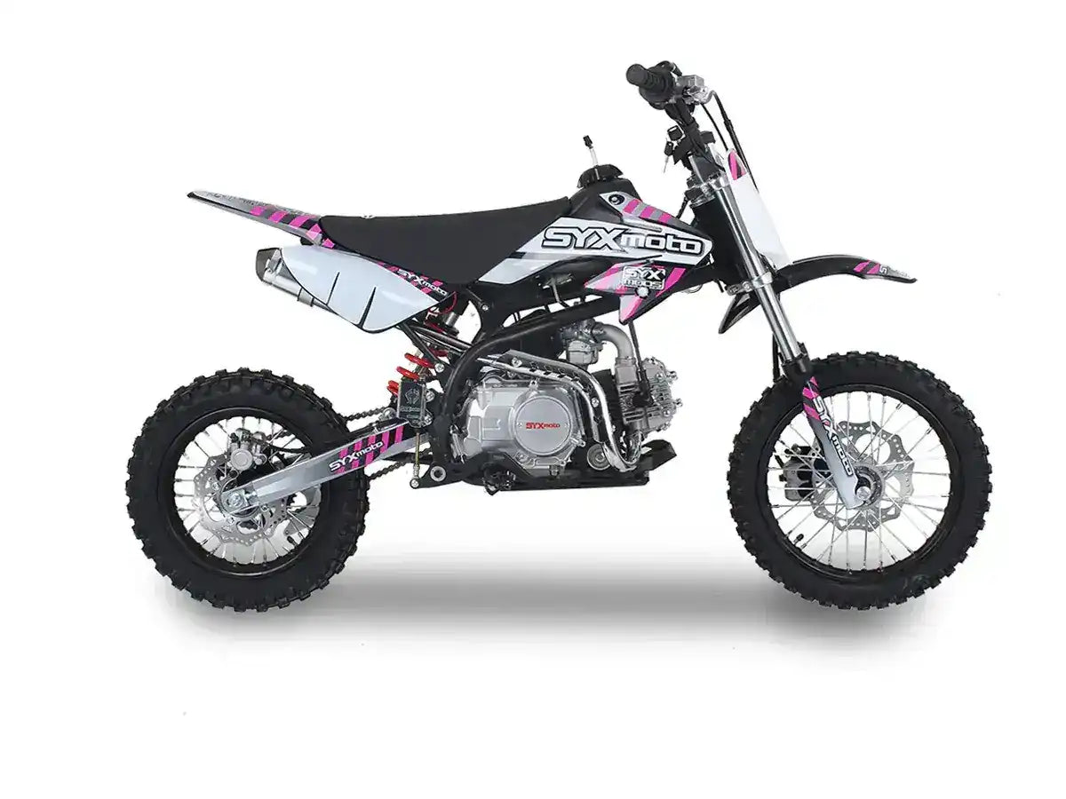 Off-road dirt bike with black, white, and pink graphics, knobby tires, and exposed engine