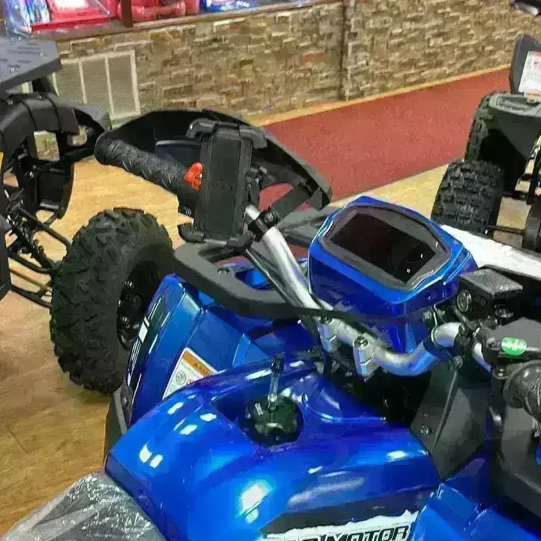 Handlebar cell phone holder mounted on blue ATV in showroom