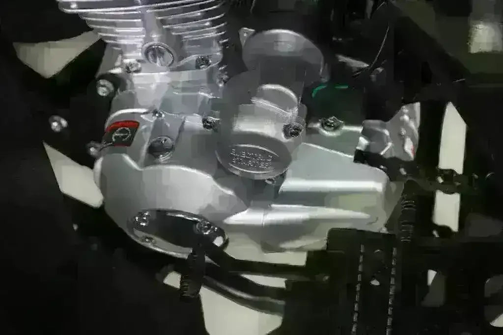 Close-up of the Rhino 250 silver engine, black shift lever and slotted footwell