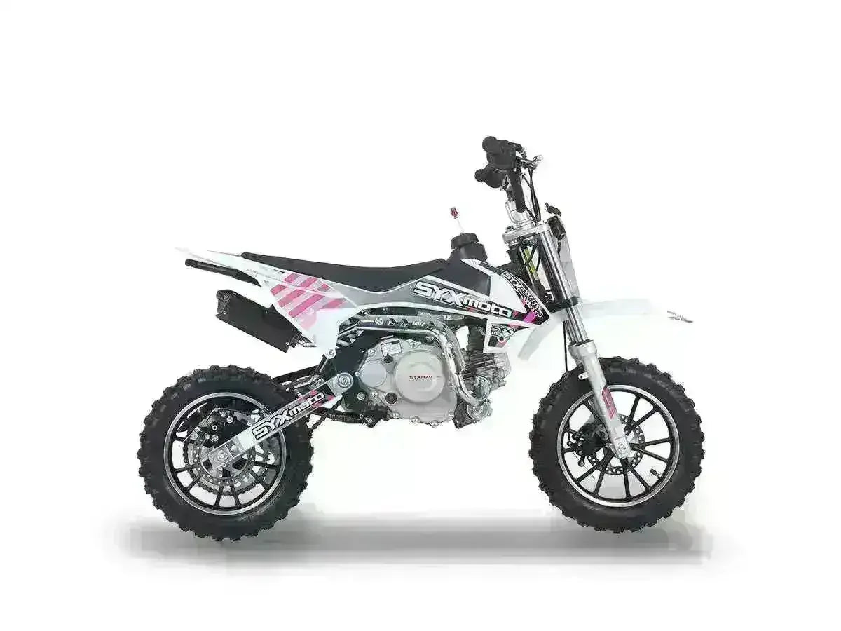 White kids pit bike with black wheels, off-road tires, and exposed engine on white background