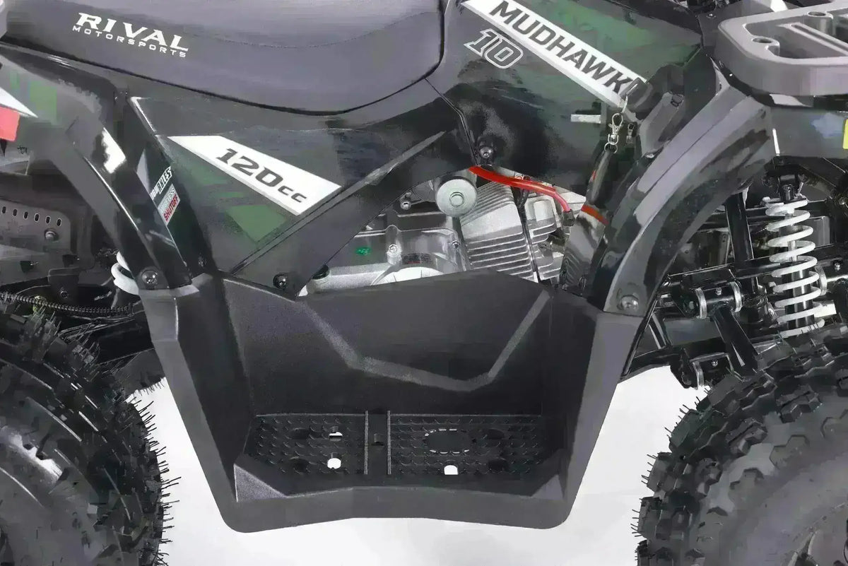 Close-up of black 125cc youth ATV with rugged tires and visible suspension system