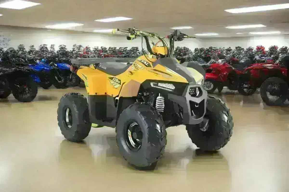 Yellow and gray Rival Mudhawk 6 ATV with white front springs and black bumper, front three-quarter view in the showroom