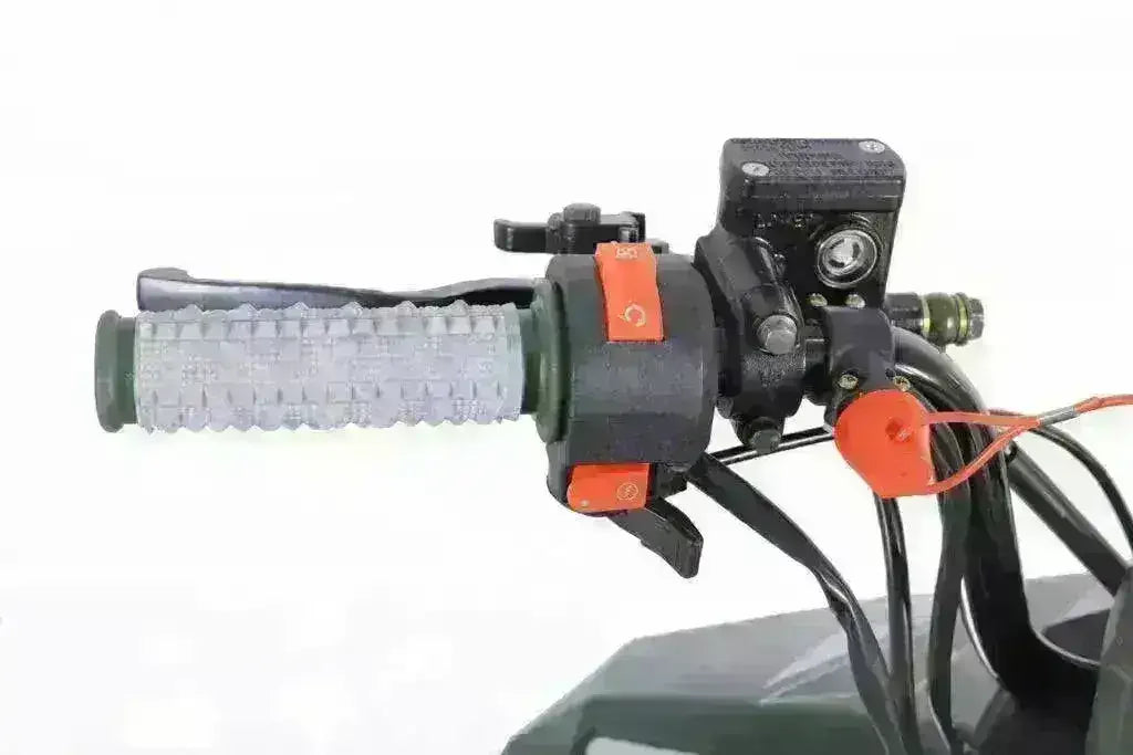 Close-up of kids ATV handlebar with textured grip and control switches