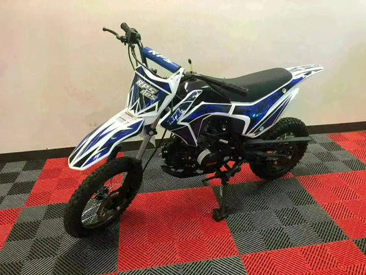 Blue and white RPS 110cc dirt bike with knobby tires on red and gray showroom floor