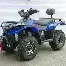 Blue 4x4 utility ATV with backrest, rugged tires, and front rack in indoor setting