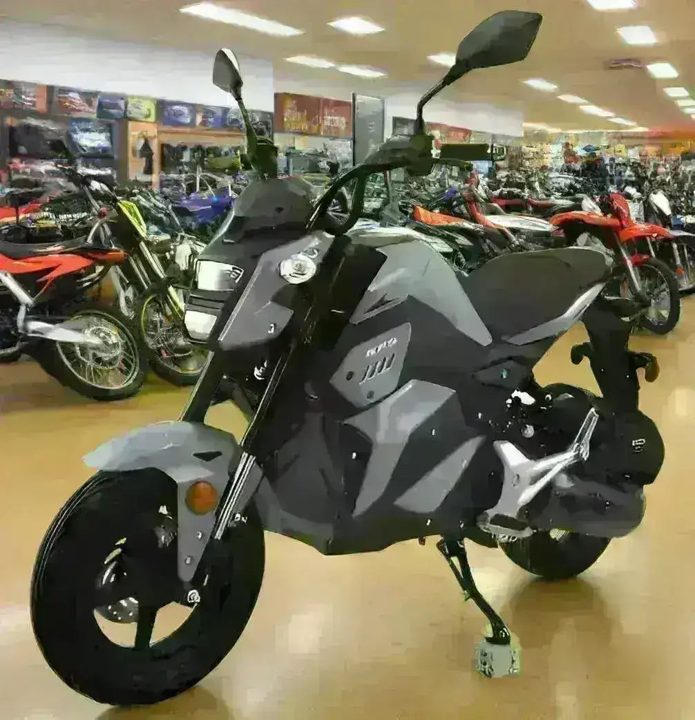 Black and gray 150cc motorcycle with angular bodywork on showroom floor, surrounded by bikes