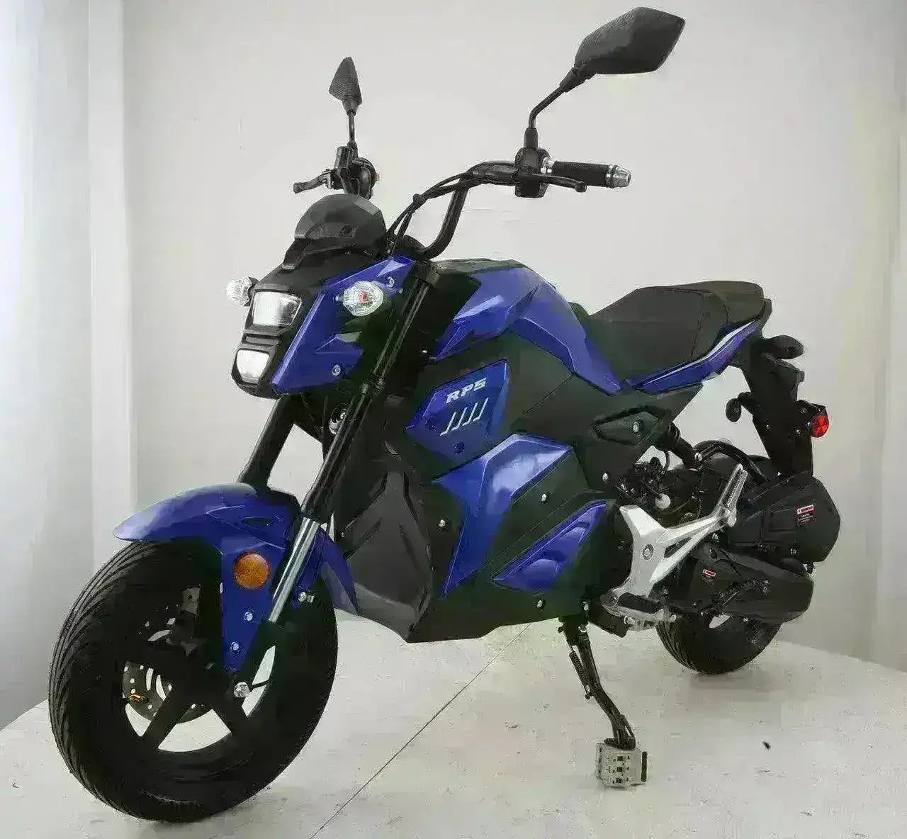 Blue RPS M-16 150cc fully automatic motorcycle with street tires in a studio setting