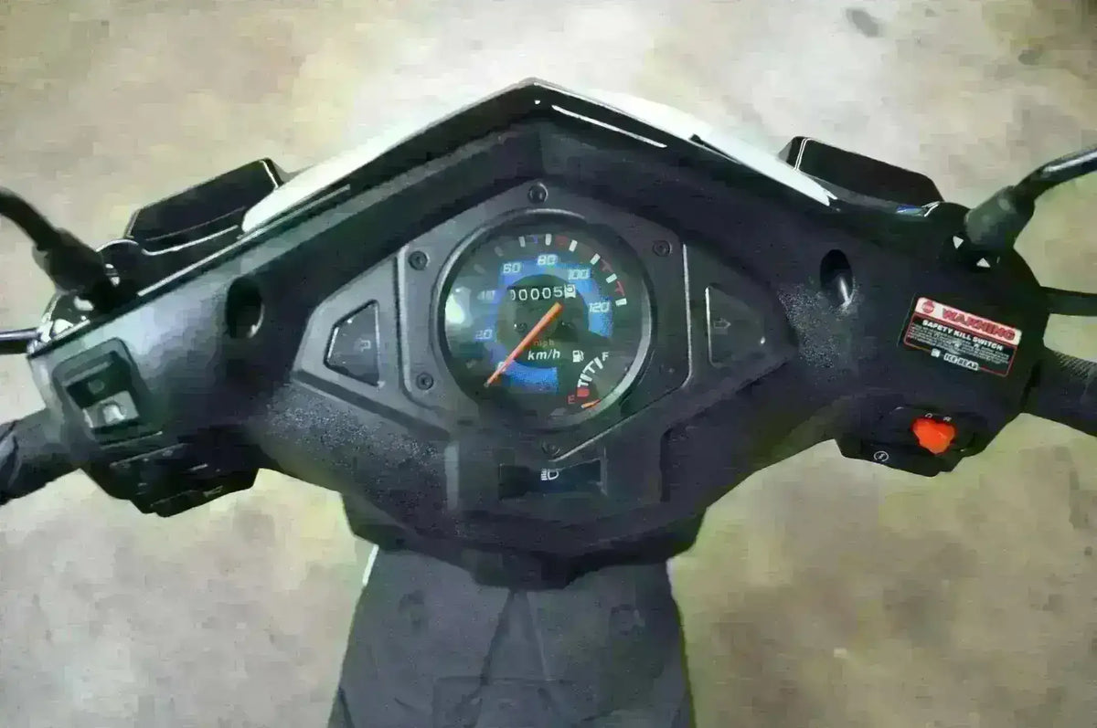 Close-up of 50cc trike scooter dashboard with speedometer and controls