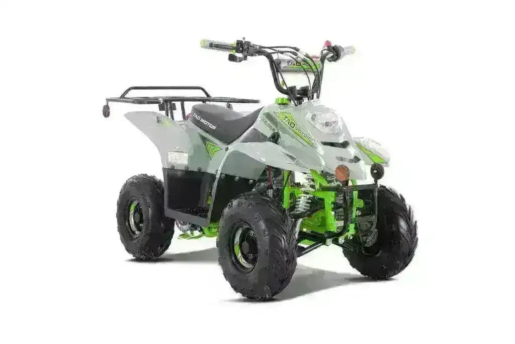 Green and white 110cc kids ATV with rugged tires and rear cargo rack on a white background