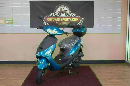 Blue 50cc scooter with top box on display indoors, ideal for commuting and campus cruising.