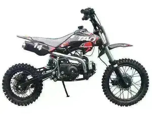 Black 110cc youth dirt bike with rugged off-road tires and number 14 decal, side view