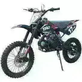 125cc youth dirt bike with knobby tires and sporty black exterior on white background