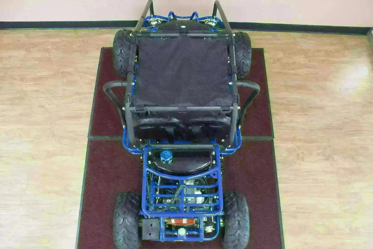 Top view of blue double seat 110cc kids go-kart with large tires on indoor wood floor