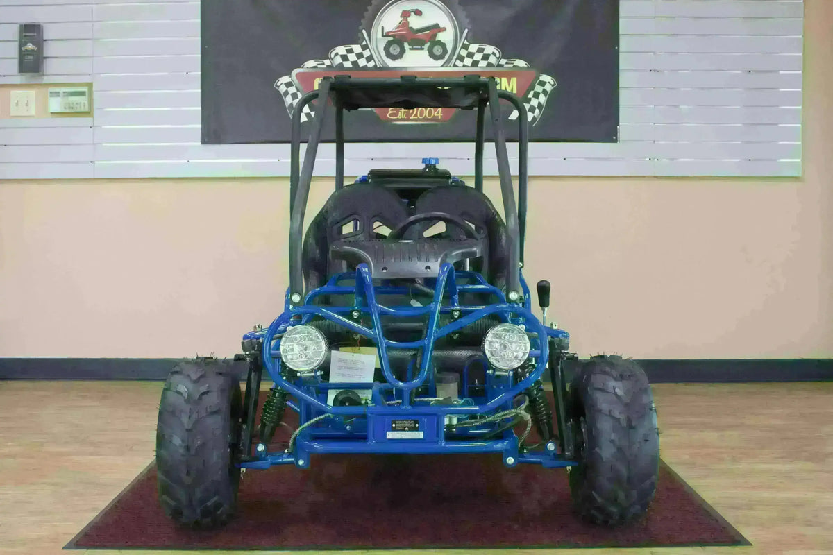 Blue double seat 110cc kids go-kart with roll cage and off-road tires in showroom