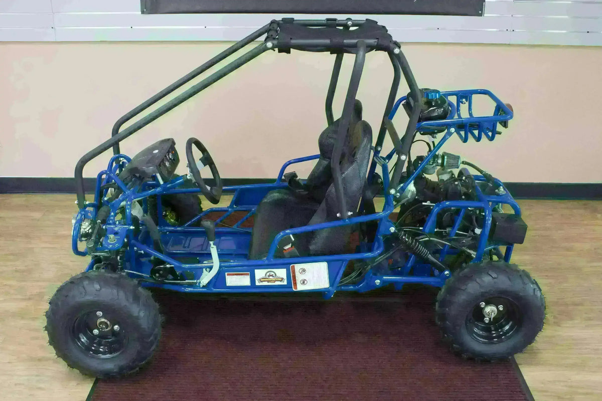 Blue double seat 110cc kids go-kart with roll cage, off-road tires, and black seats indoors