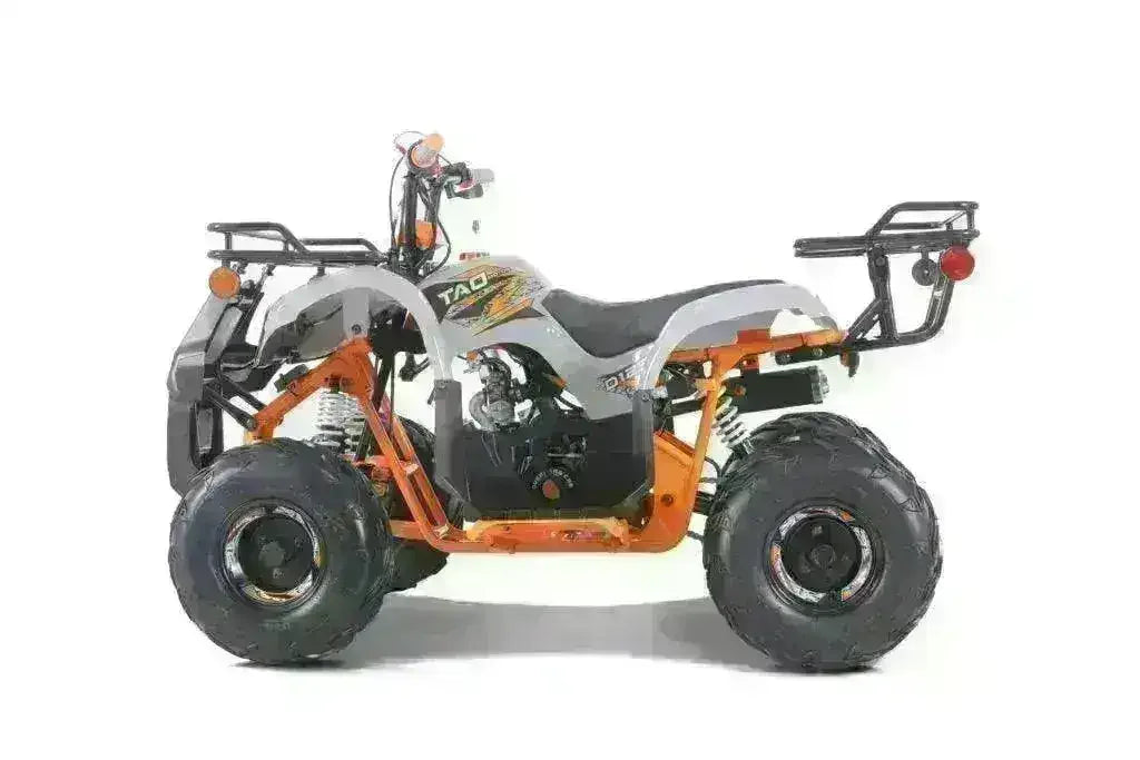 Side view of a youth utility ATV with orange frame, black seat, and rugged tires