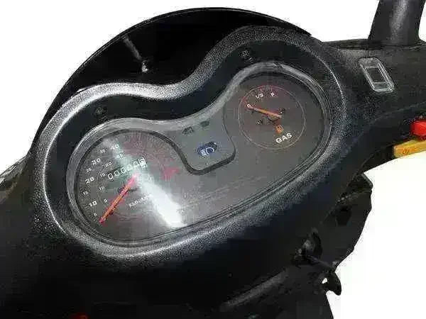 Close-up of 50cc scooter dashboard showing speedometer and fuel gauge