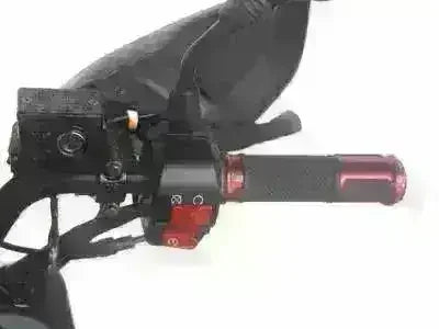 Close-up of red scooter handlebar grip and controls for gas-powered 150cc scooter