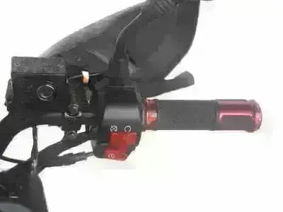 Close-up of red scooter handlebar grip and controls for gas-powered 150cc scooter