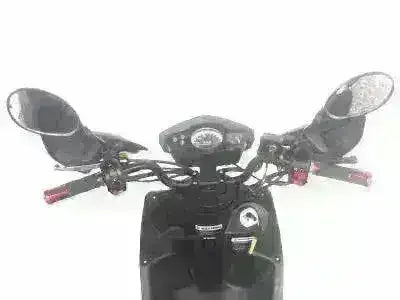 Close-up of black 150cc gas-powered scooter handlebars and dashboard controls