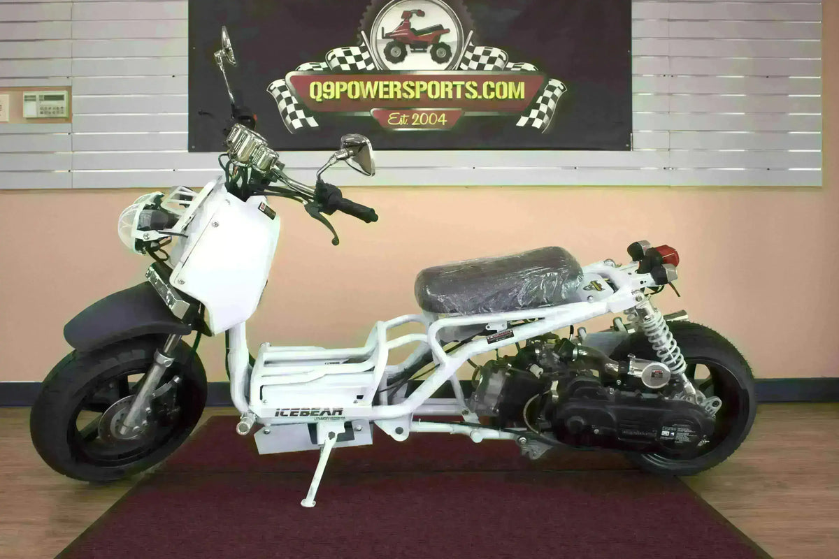 White 50cc Icebear scooter with black seat and exposed frame on showroom floor