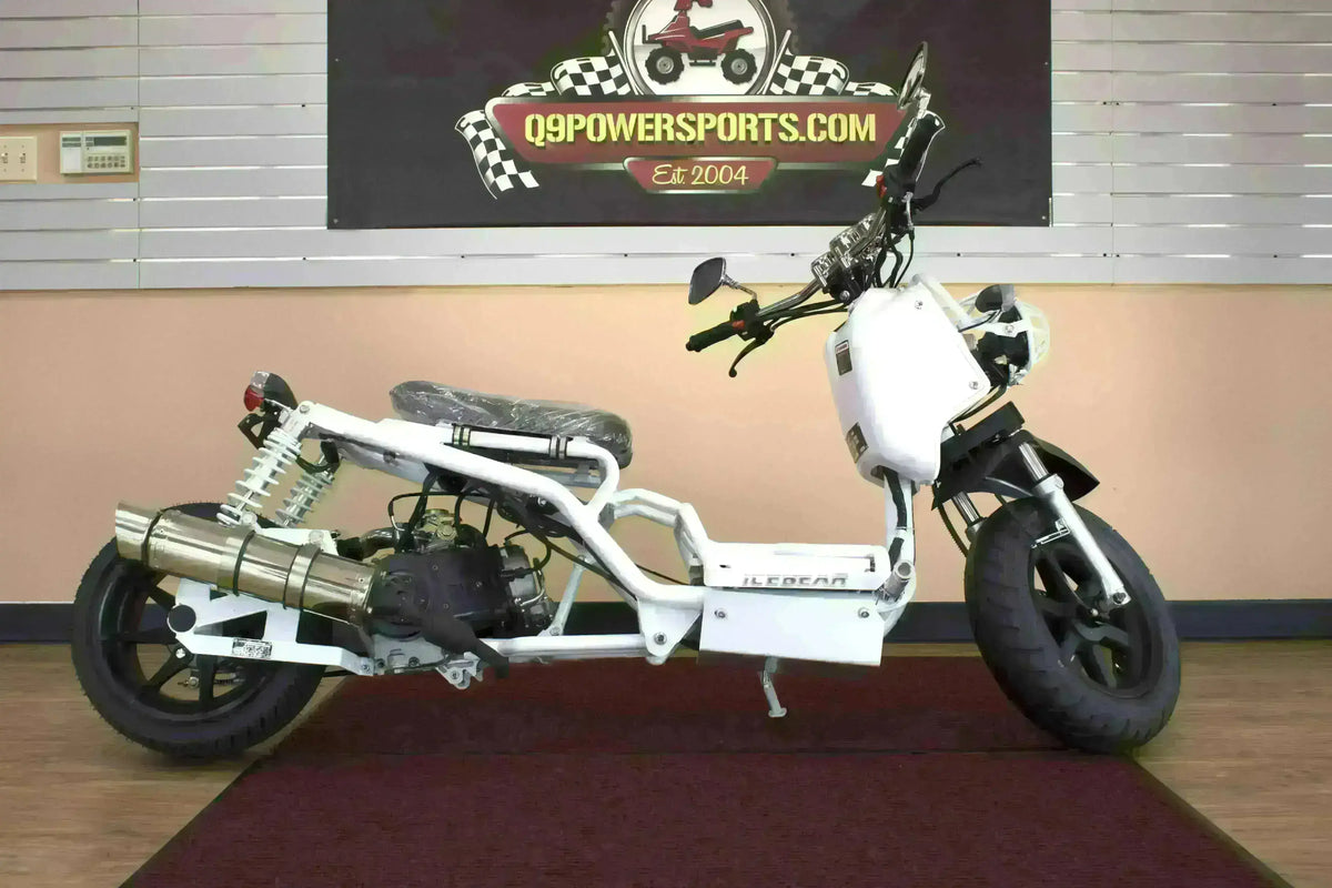 White 50cc Maddog scooter with exposed frame and black wheels, displayed indoors.