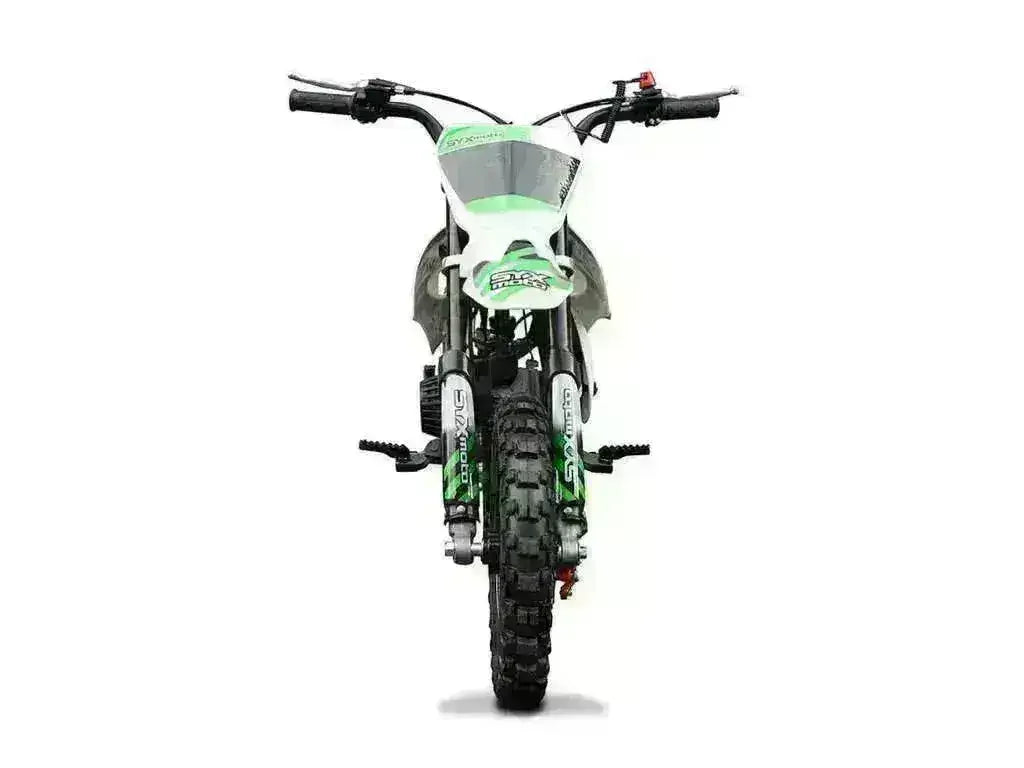 Front view of a green and white small junior dirt bike for kids with knobby tires