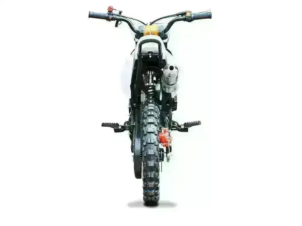 Rear view of kids small dirt bike with knobby tire and rugged foot pegs on white background