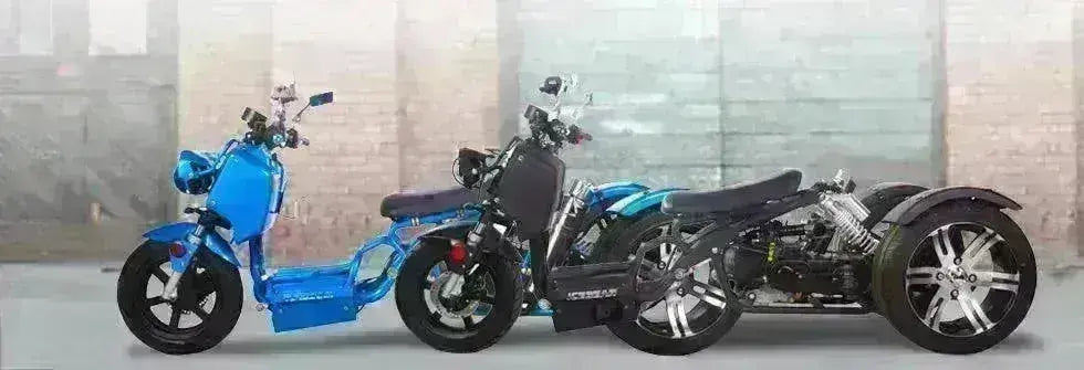 Blue 50cc trike scooter for youth by Q9 PowerSports USA, parked by a brick wall background