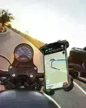 Handlebar cell phone holder mounted on motorcycle with GPS navigation on screen