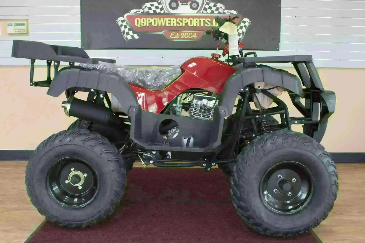 Right-side view of a red Rhino 250 utility ATV showing black footwell, cargo racks and plastic-covered seat in the showroom
