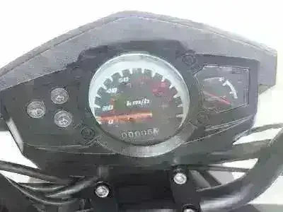 Close-up of scooter dashboard with speedometer and fuel gauge, modern scooter controls