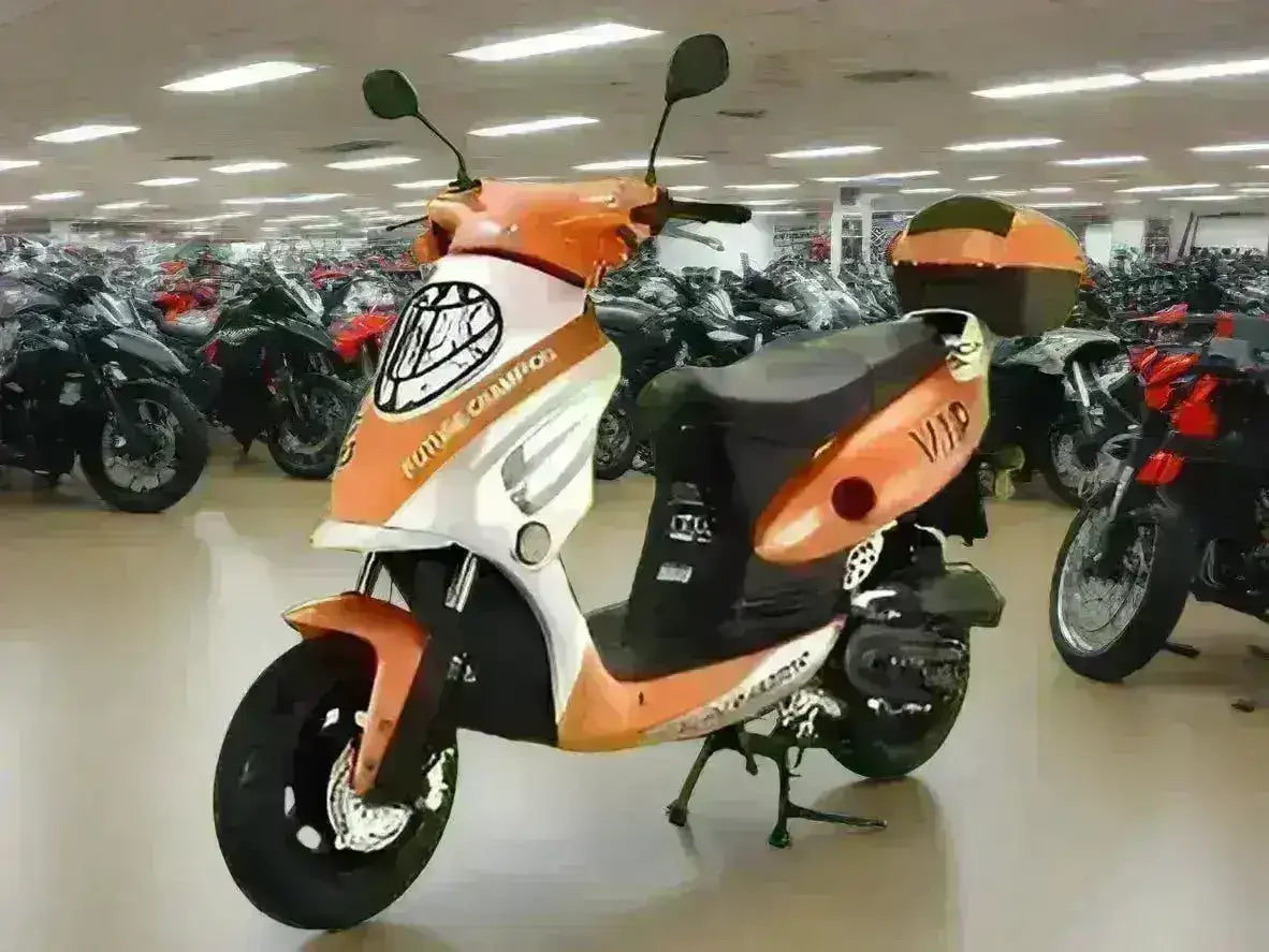 Orange and white retro Metro VIP 50cc scooter on showroom floor with motorcycles
