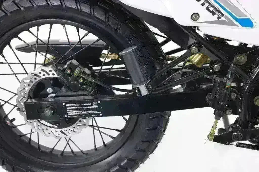 Close-up of rear wheel, disc brake, and suspension on a 250cc dual sport motorcycle