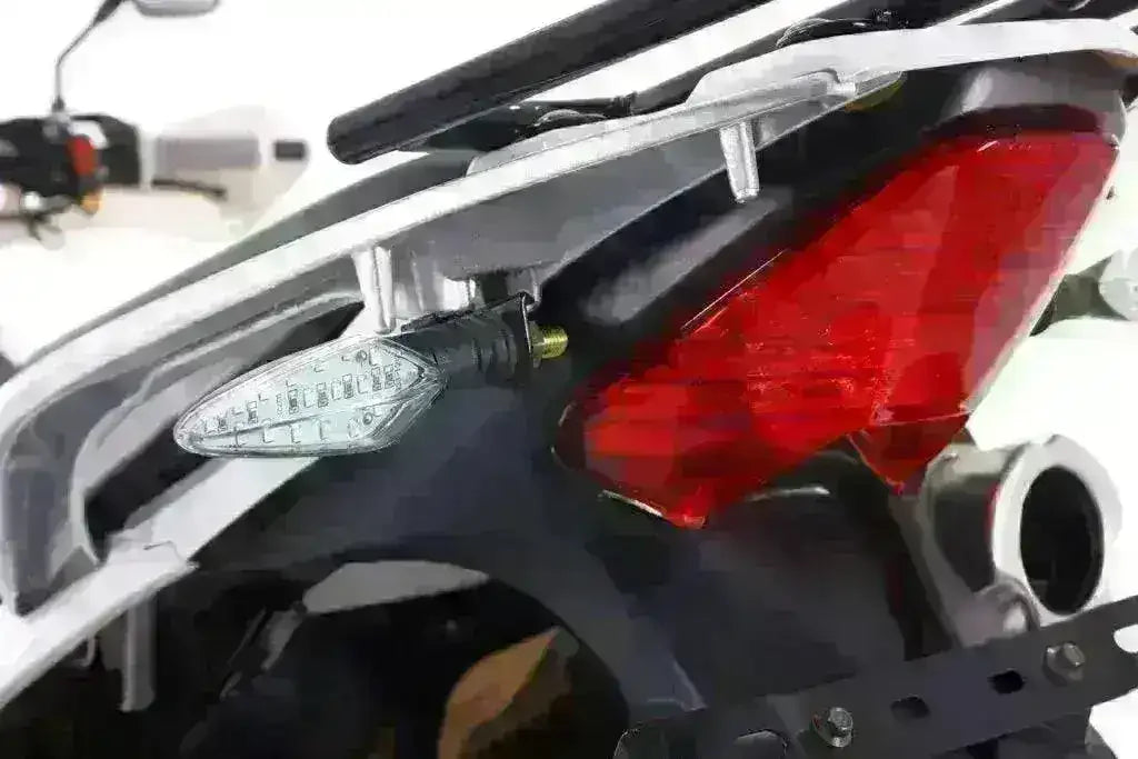 Close-up of motorcycle rear LED brake light and turn signal on a road-legal bike